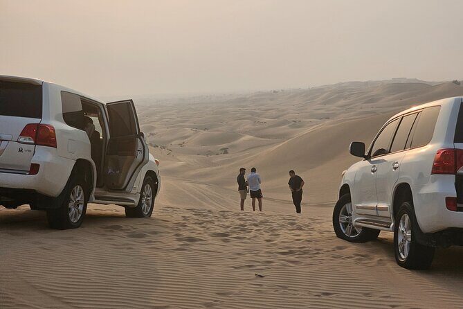 Abu Dhabi Desert Safari With Live Shows And BBQ Buffet Dinner - Camel Ride and Sandboarding: Classic Desert, Real-World Comfort