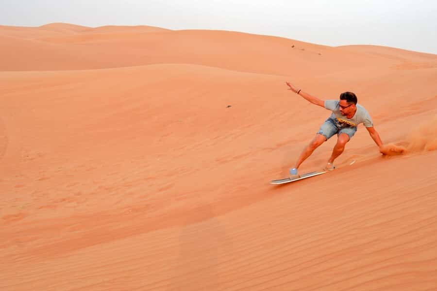 Abu Dhabi: Morning Desert Tour, Camel Ride & Sandboarding - Sandboarding: how to glide without panicking on the first run