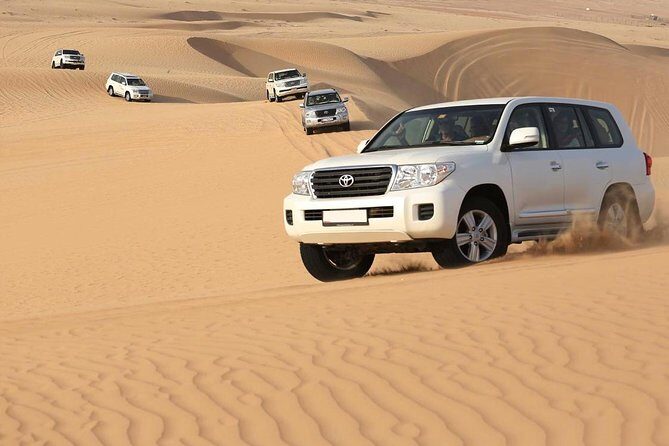 Best Dubai Desert Safari with Buffet Dinner,Sand Boarding & Shows - At the Camp: Camel Ride, Henna, and Shisha in a Real-World Setting