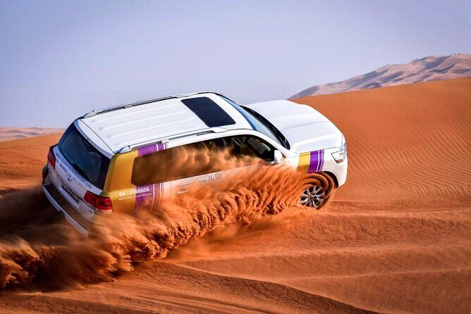 Desert Safari Evening Tours:- Special Rides, BBQ Buffet ,Live Entertainment - Sandboarding: included fun with a short learning curve
