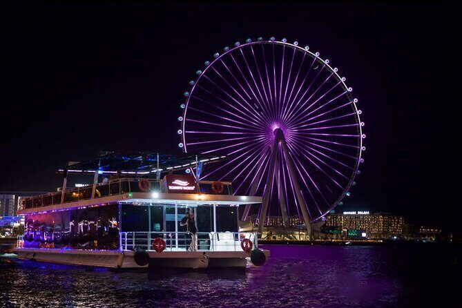 Dubai: 1-Hour Ain Boat Cruise - Boarding the boat: open-air views, seating, and onboard atmosphere