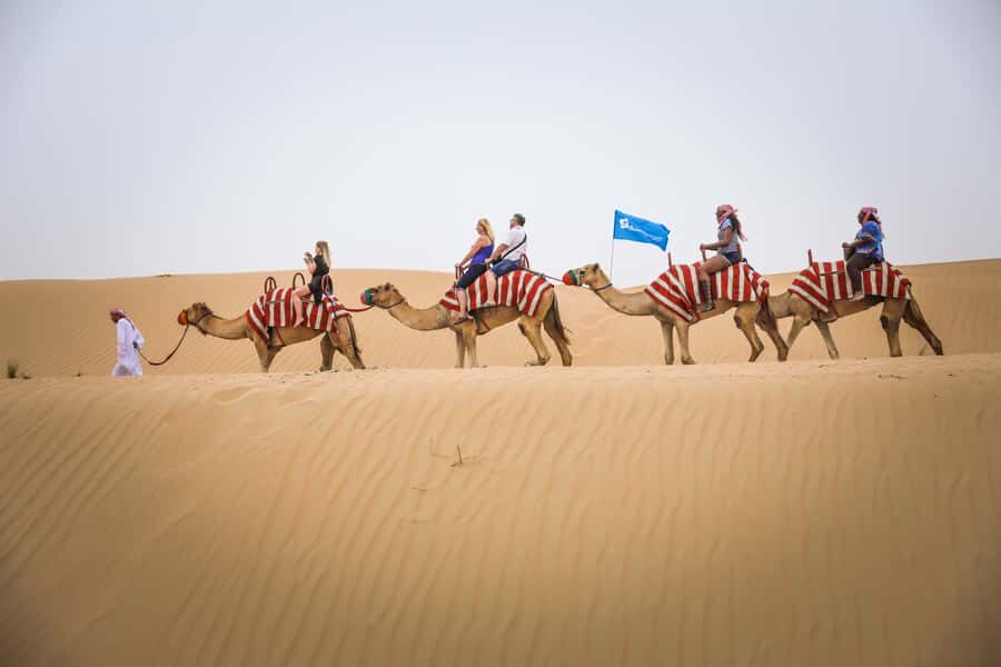 Dubai: Adventure Quad Bike Safari, Camel Ride & Refreshment - Pick the right time for sunset across the dunes