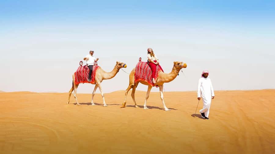 Dubai: Desert Safari, Camel Ride, Sandboarding, Quad Bike - The Camp Evening: BBQ and a Traditional Dance Show, Done on a Schedule