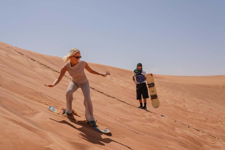 Dubai: Desert Safari, Quad Bike, Camel Ride & Al Khayma Camp - Sandboarding: the easiest way to turn sand into fun photos