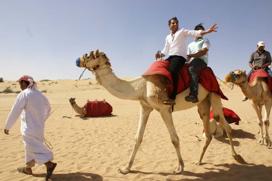 Dubai: Desert Safari, Quad Bike, Camel Ride and Sandboarding - Pickup and Timing: How the Half-Day Runs