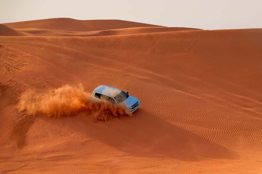 Dubai: Desert Safari, Quad Bike, Sandboarding, Camels & BBQ - Sandboarding: The One Activity You Can’t Fake