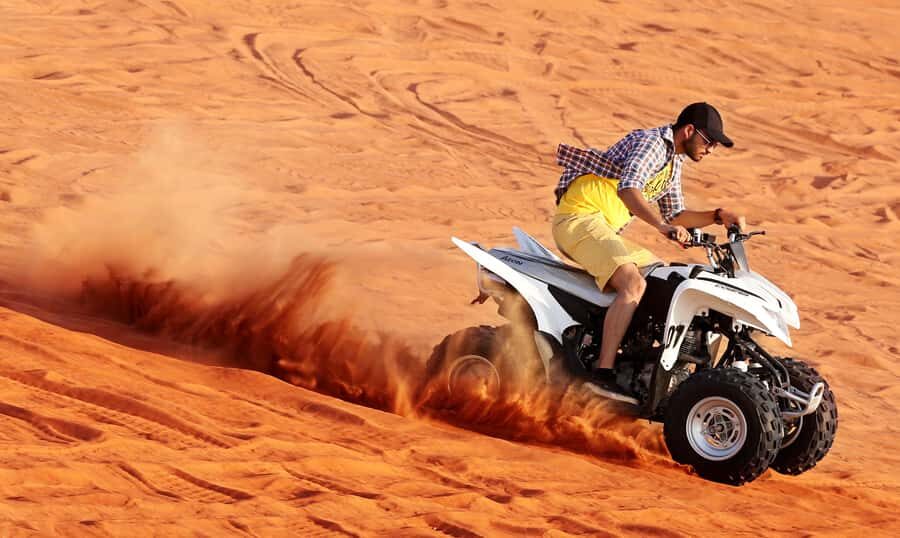 Dubai: Desert Safari, Quad Bike, Sandboarding, Camels & BBQ - Desert Camp Arrival: Dates, Shisha, Henna, and Sunset Photos