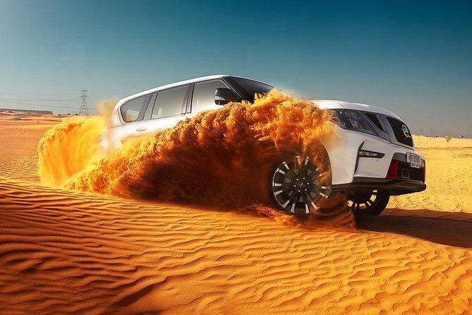 Dubai Desert Safari With BBQ, Quad Bike And Camel Ride - Camp arrival: Arabic welcome drinks, henna, and photo time