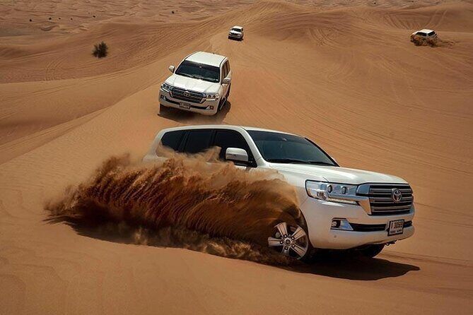 Dubai Evening Desert Safari & BBQ Dinner - Camp time in Al Awir: camel ride, sand fun, and sunset timing