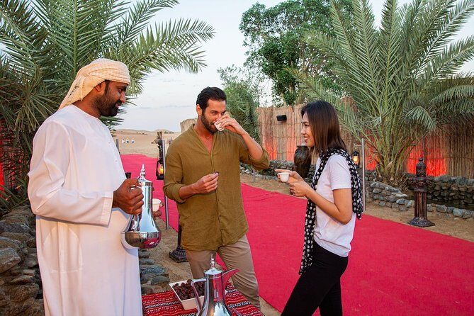 Dubai Evening Desert Safari: Sandboarding, BBQ, Camel Ride & more - The Camp Evening: Falcon Display, Fire, and Dance