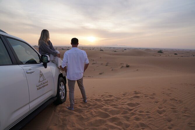 Dubai Evening Desert Safari: Sandboarding, BBQ, Camel Ride & more - Camel Ride, Sandboarding, and Henna: Where the Culture Turns Hands-On