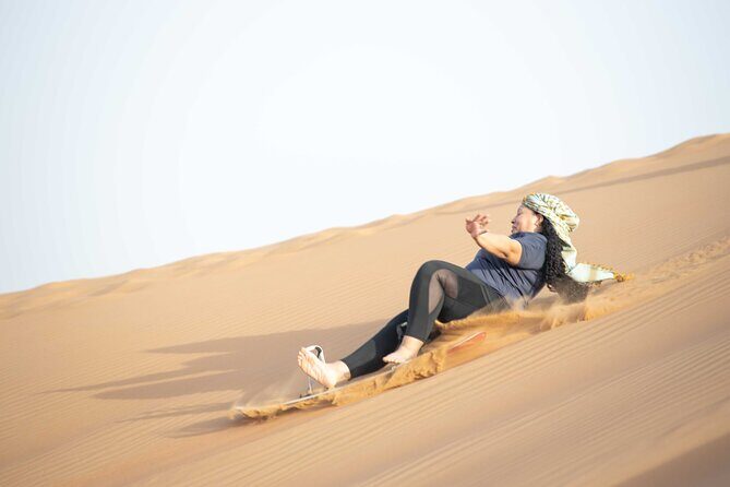 Dubai Half-day Red Dunes bashing with Sandboarding, Camel &Falcon - Dune Bashing: 30 to 40 Minutes of Controlled Chaos