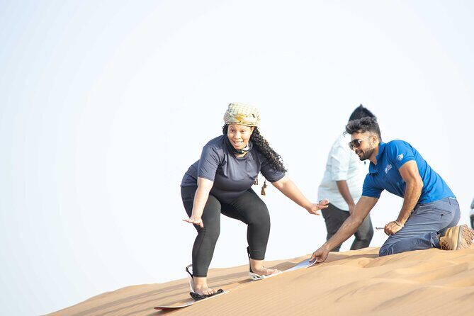 Dubai Half-day Red Dunes bashing with Sandboarding, Camel &Falcon - Sandboarding After the Adrenaline Hit