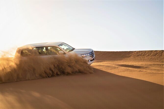 Dubai Half-day Red Dunes bashing with Sandboarding, Camel &Falcon - Soft Drinks, Mineral Water, and the Small Comfort Wins