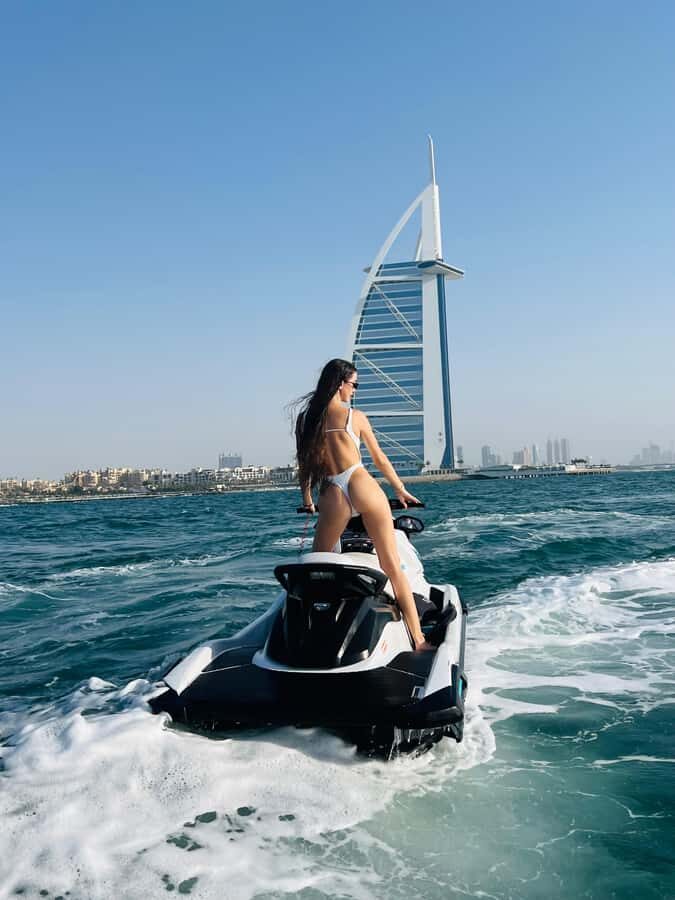 Dubai: Jetski to Burj Arab-Atlantis w Pic, Video & Icecream - Cruising past Jumeirah Beach: fast, scenic, and built for photos
