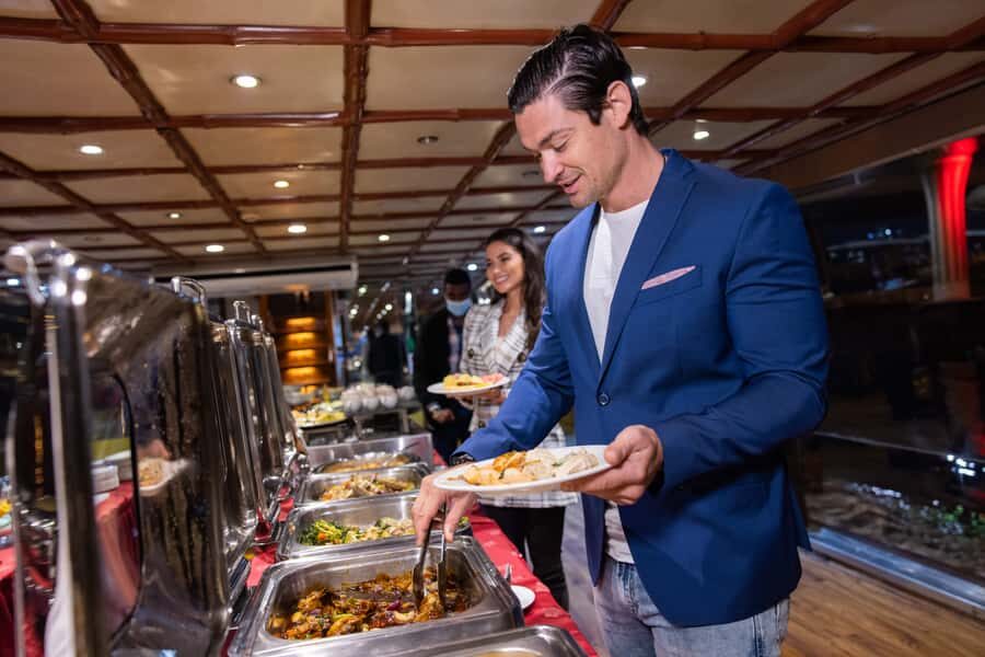 Dubai: Luxury Canal Dinner Cruise with Optional Transfers - Entertainment schedule: saxophone and the included show stop