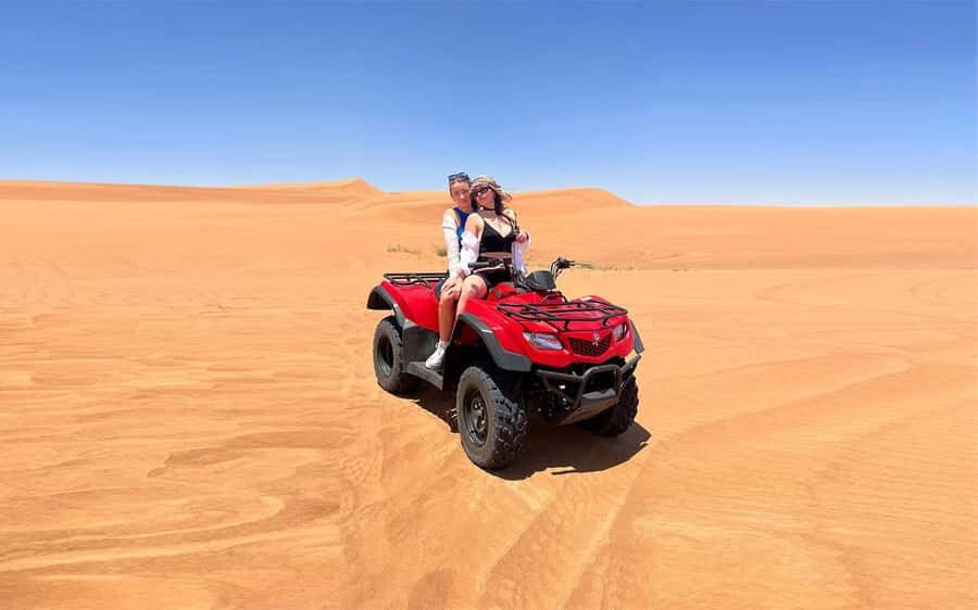 Dubai: Quad Bike, Dune Buggy, and Sandboarding Experience - ATV Driving Across Red Dunes: Adrenaline, Instruction, and Risk