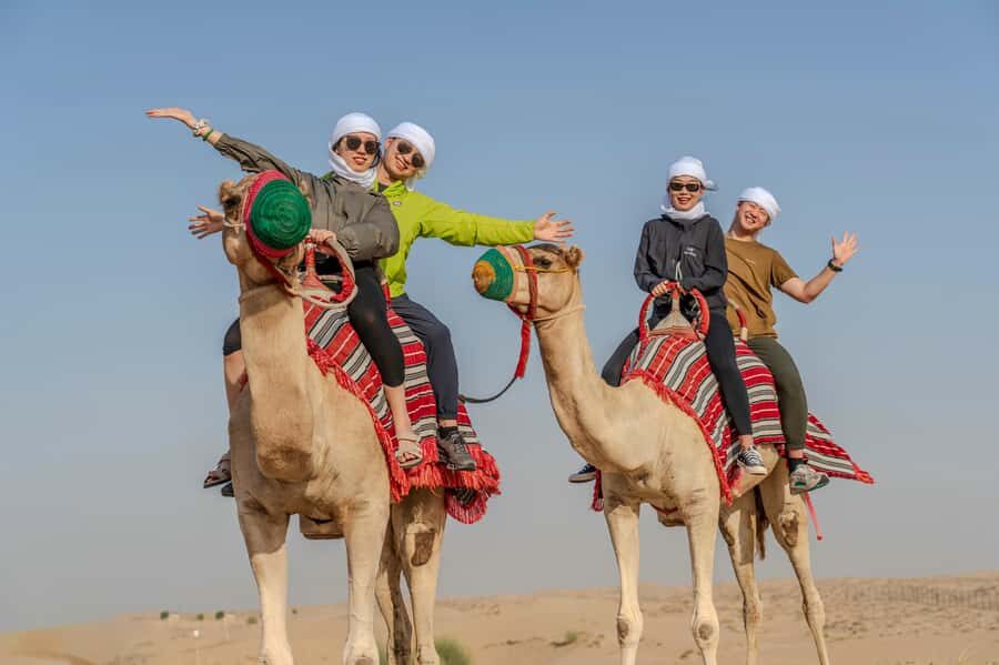 Dubai: Quad Bike Safari, Camels & Al Khayma Camp BBQ Dinner - Sandboarding and the dune photo stop that breaks up the action
