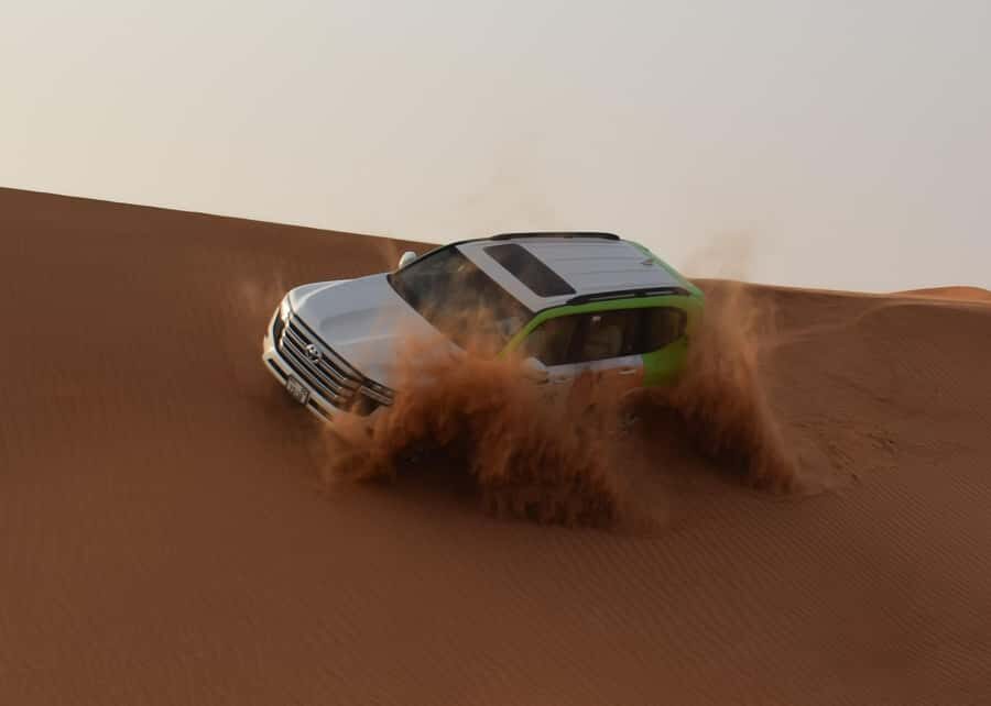 Dubai: Red Dune Safari, Quad Bike, Camel Ride, BBQ Dinner - The Desert Station Stop: Toilets, Shops, and Tire Pressure