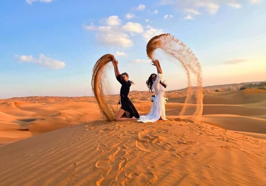 Dubai: Red Dunes Evening Quad Bike, Dune Blast with BBQ - Camel ride, falcon photos, and henna at the camp