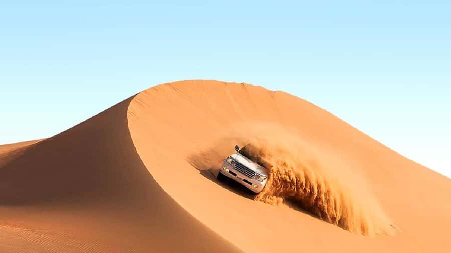 Dubai: Safari, Quad Bike, Camel Ride, and Buffet Dinner - Entering The Desert: Pickup to Lahbab Desert