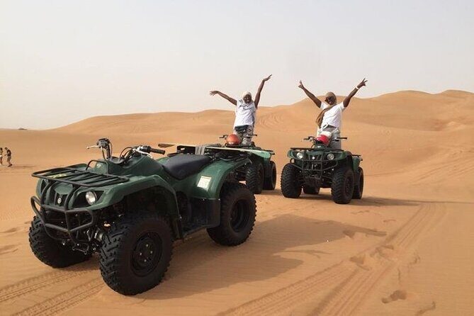 Dubai Self-drive Quad Bike, Sand Boarding, Camels & Refreshments - Sandboarding: fast fun after the quad ride