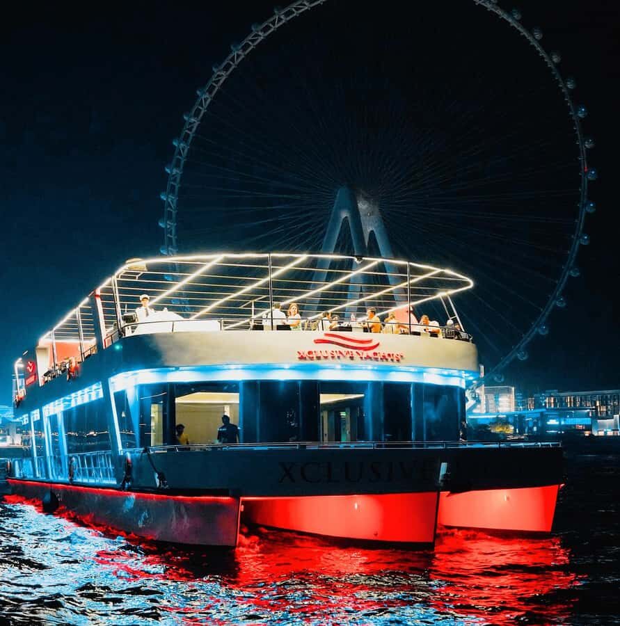 Dubai: Sunset or Dinner Cruise with Live Music & Open Bar - Two decks, one evening: lower glass views vs upper deck breeze