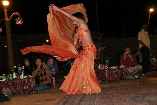Evening Desert Safari & BBQ With Live Shows,Camel Ride,Falcon pic - The Dinner and Show Program: Belly Dance, Tanoura, Fire