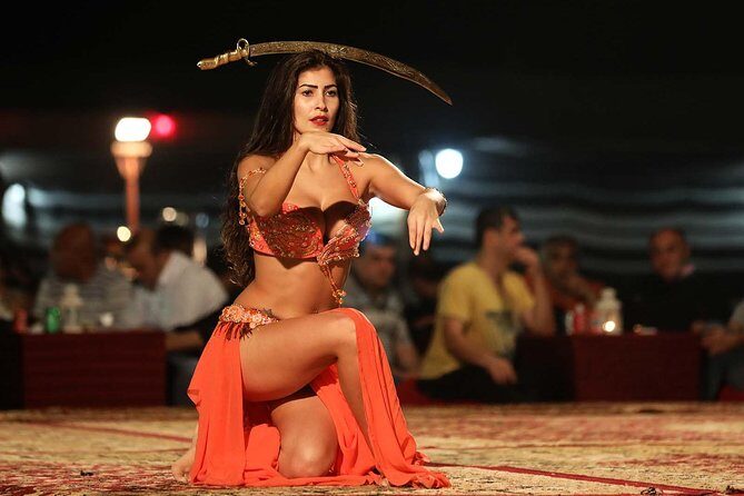 Evening Dubai Safari with BBQ, Dance Shows & Quad Biking optional - Camel Ride, Sandboarding, Henna, and the Falcon Photo