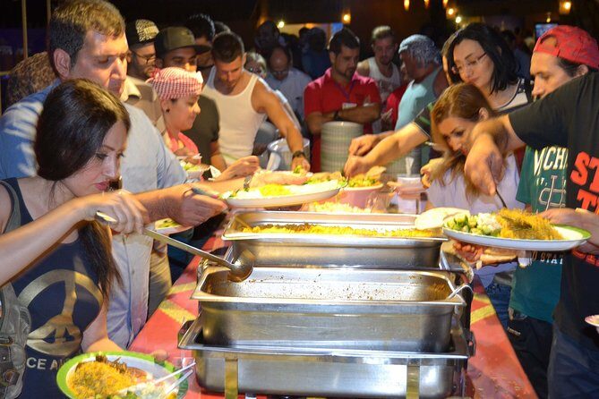 Evening Red Dunes Safari with Quad Biking, BBQ Dinner & LiveShows - Premium Desert Camp at Al Awir: Arabic Attire, Henna, and the BBQ Setup