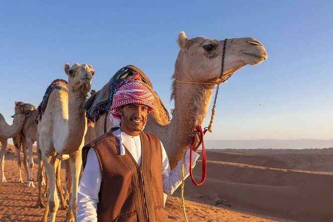 Morning Desert Safari with Quad Bike, Camel Ride & Sandboarding - Sandboarding with an Instructor: When Your Feet Become the Balance Board