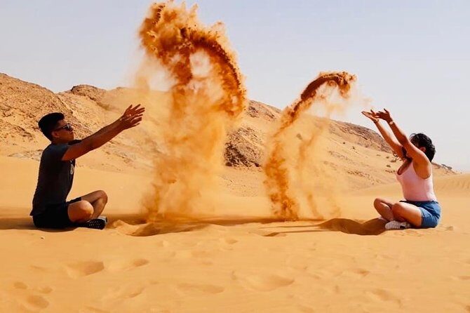 Morning Red Dunes with Camel Ride, Sandboarding and Refreshments - Desert camp refreshments: Lukaymat, dates, Arabic coffee