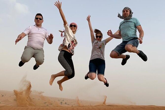 Premium Evening Desert Safari, Quad Bike, Camel & VIP BBQ Dinner - Al Aweer desert camp: Tanoura, belly dance, fire show, and BBQ under the stars