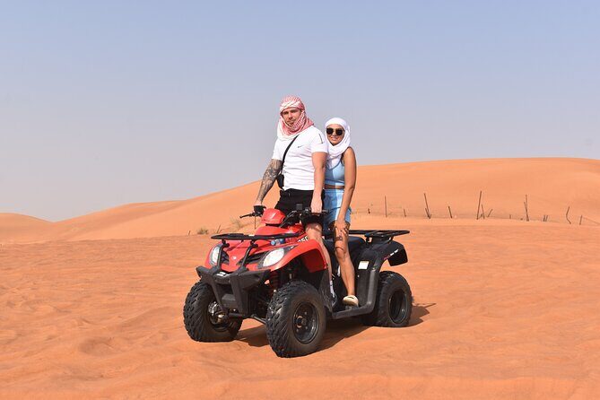Sunset Desert Safari Quad bike Camel ride Sand Board & BBQ Dinner - Key moments to expect at a glance