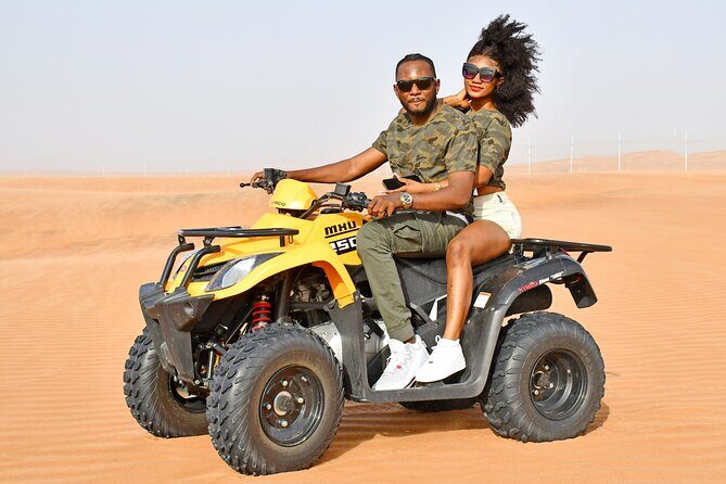 Sunset Desert Safari Quad bike Camel ride Sand Board & BBQ Dinner - Dune bashing, sandboarding, and sunset photo moments